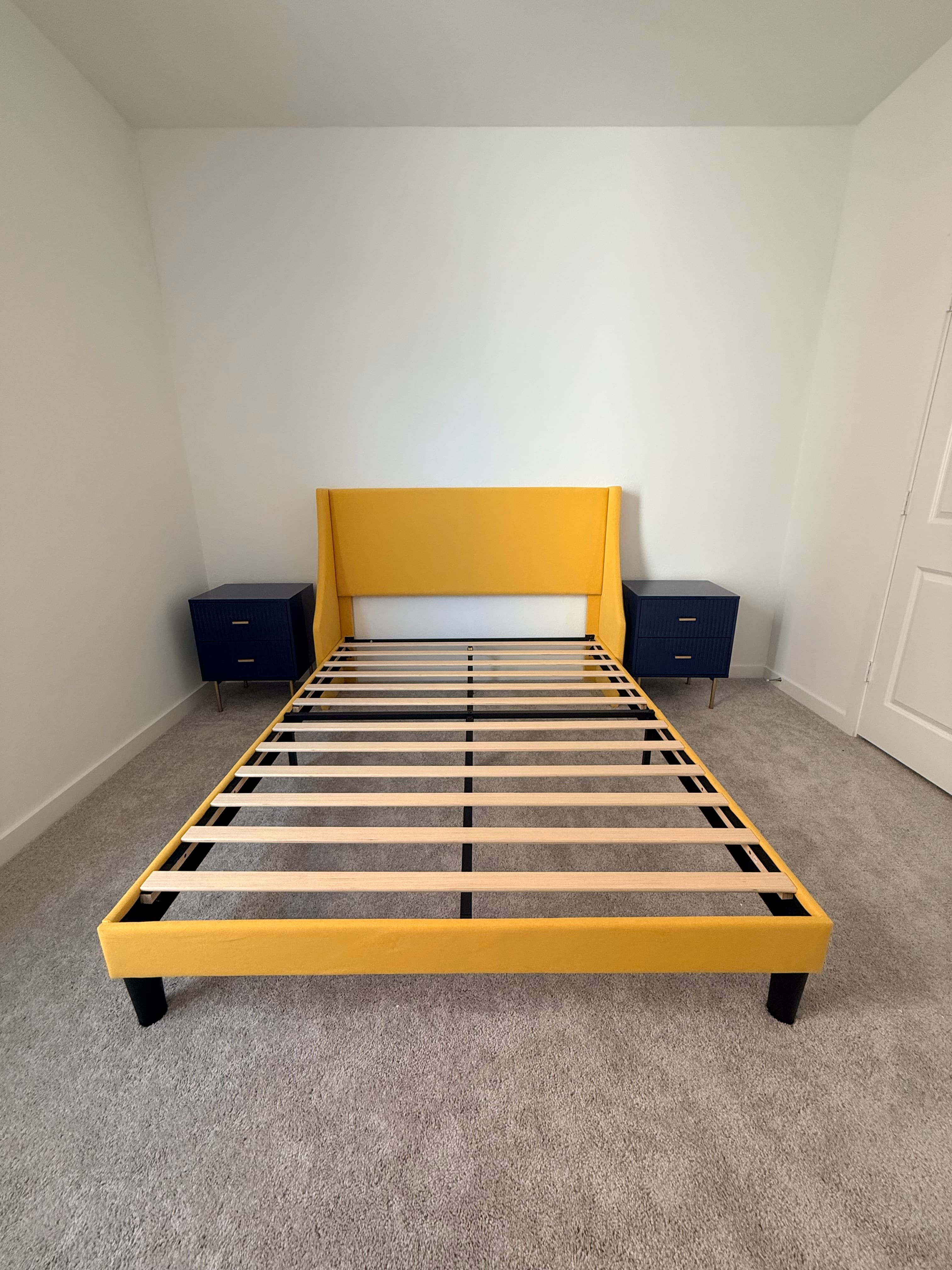Yellow and navy blue children's bed frame with slat base