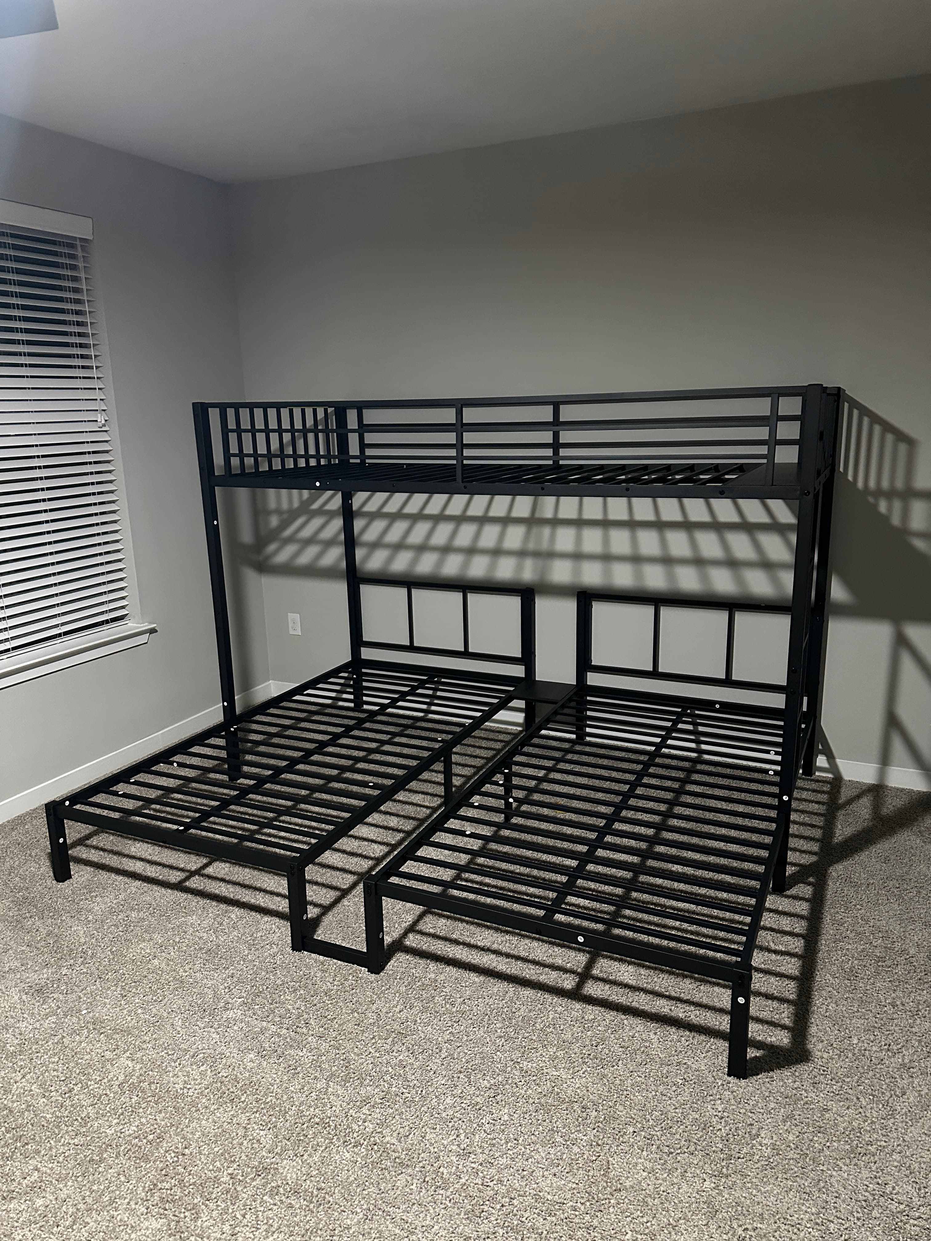 Black metal bed frame with vertical bar design