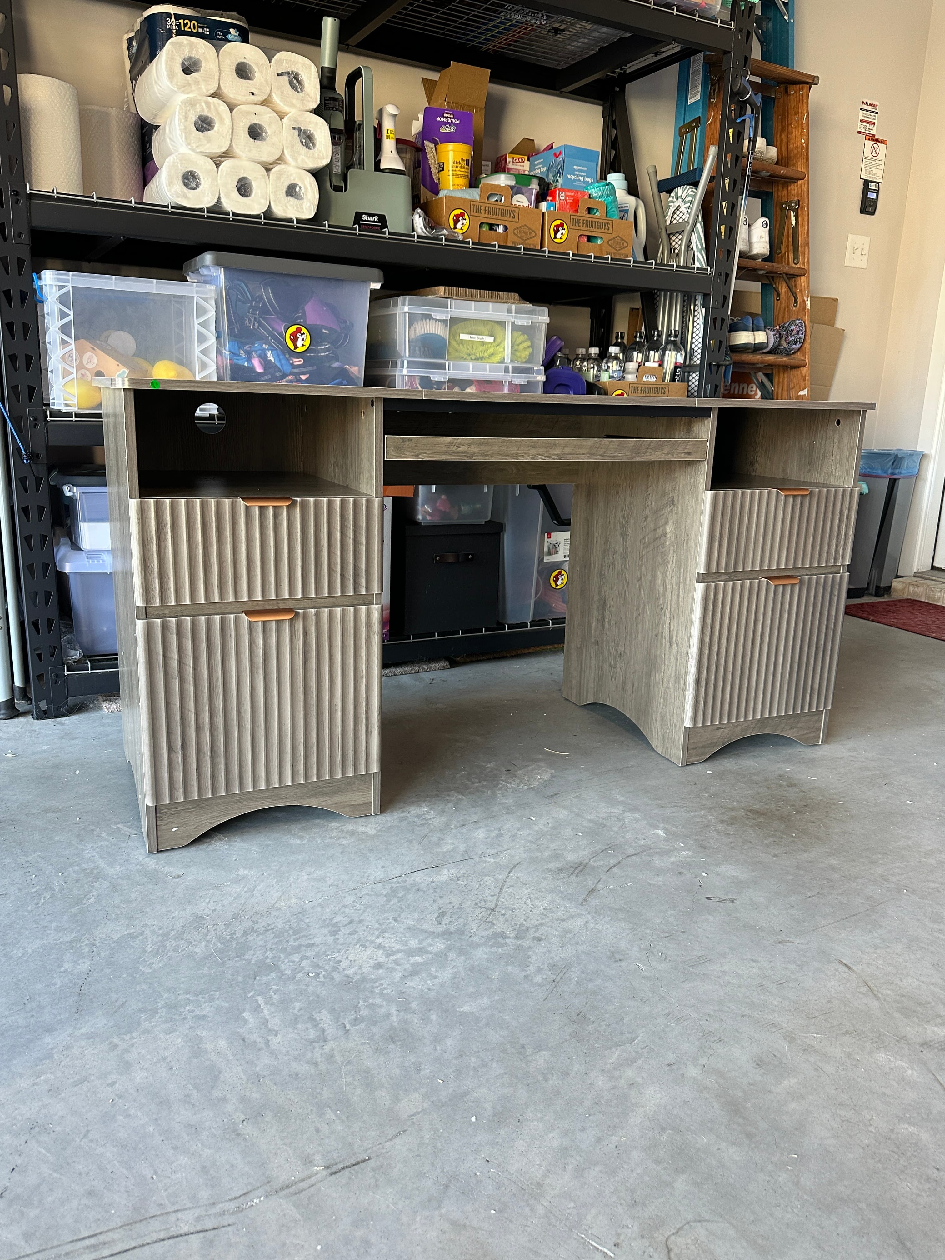 Gray wooden desk with slatted drawer fronts