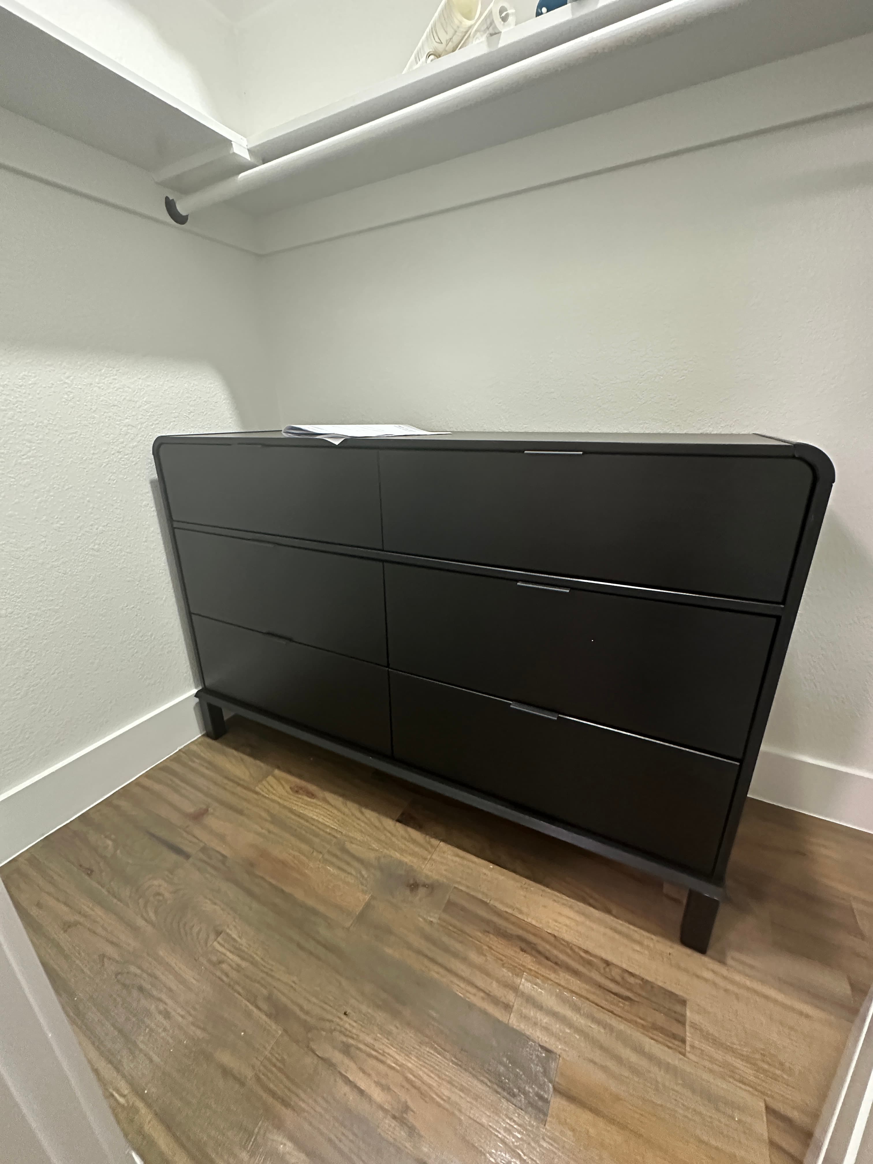 Black three-door wardrobe