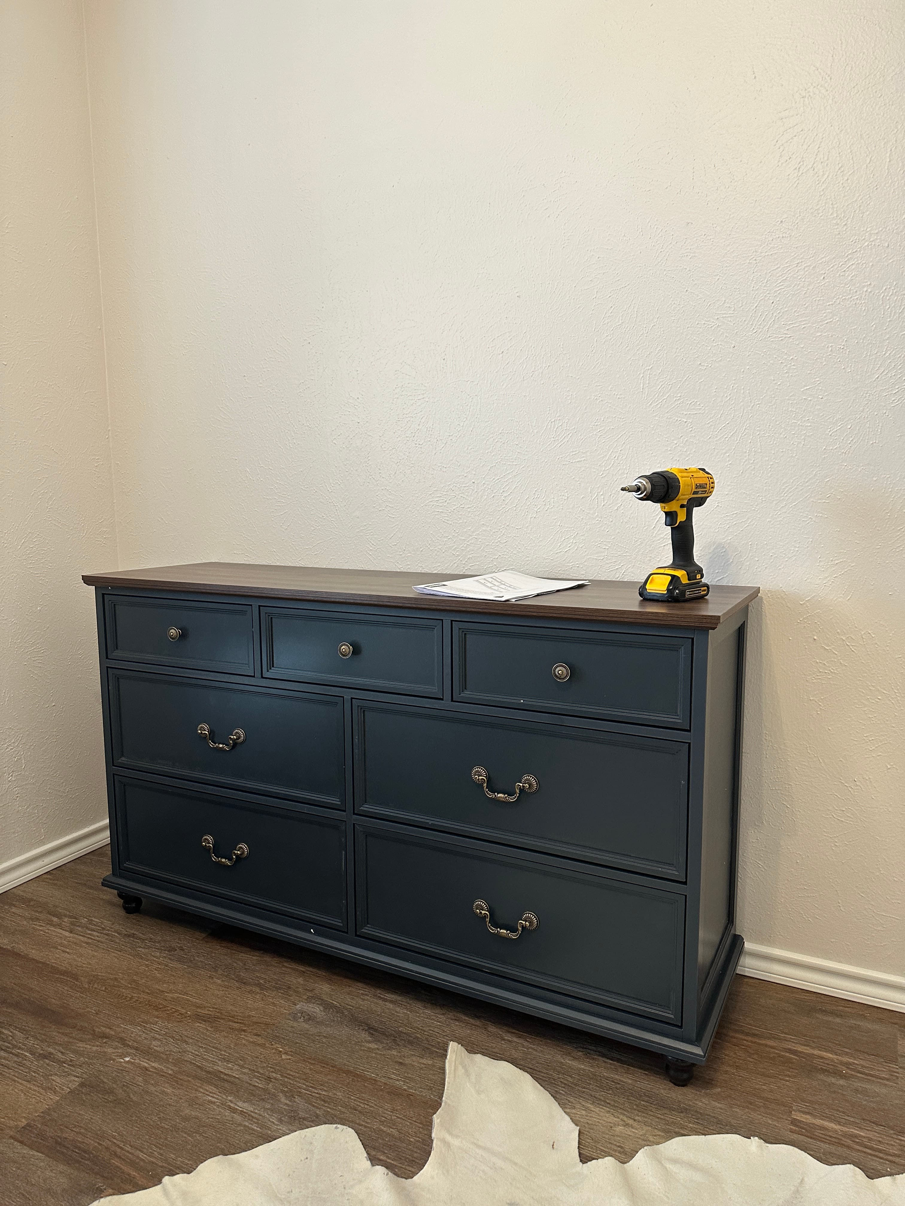 Dark teal dresser with brass handles