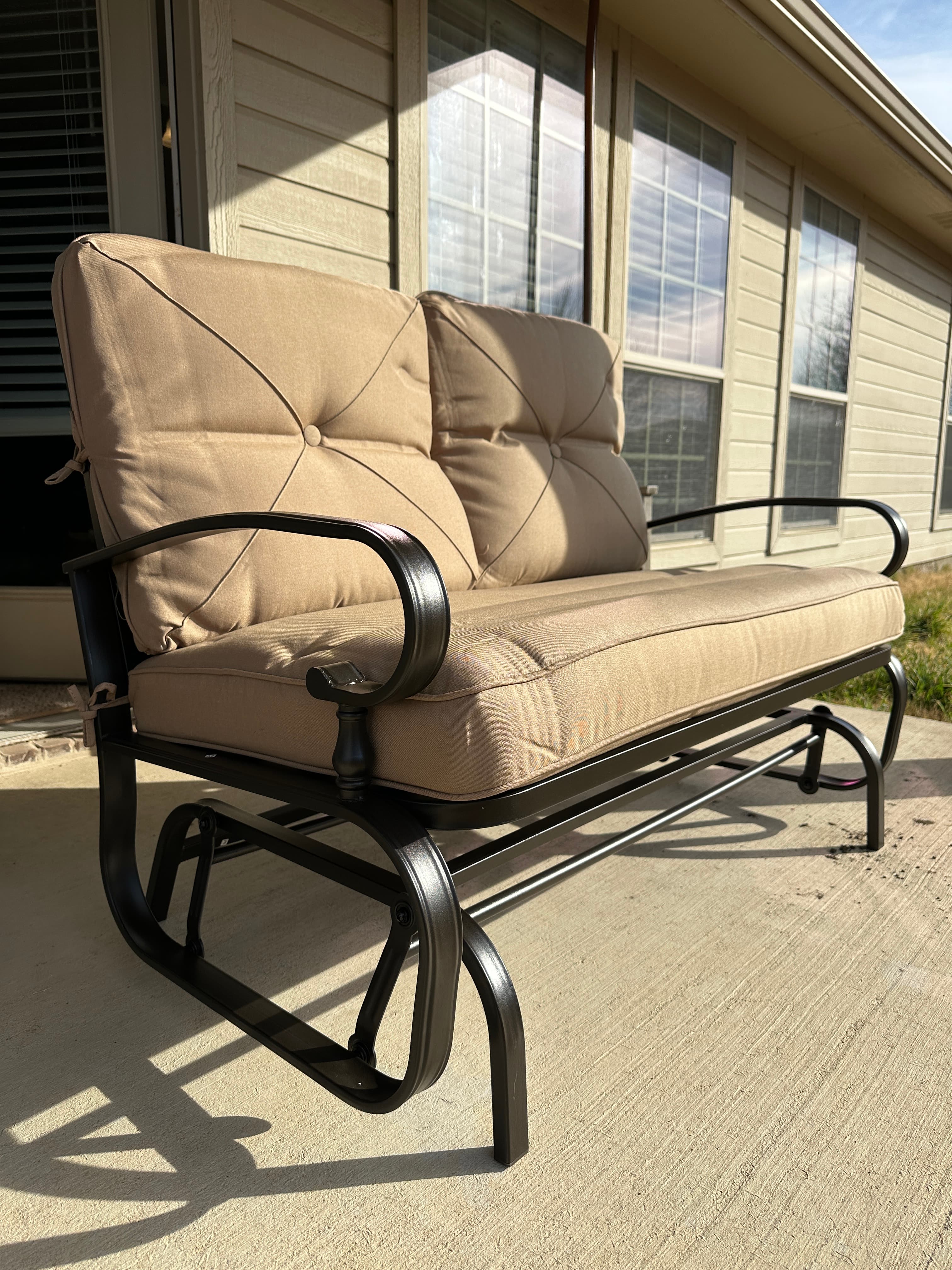 Outdoor patio glider bench with cushions
