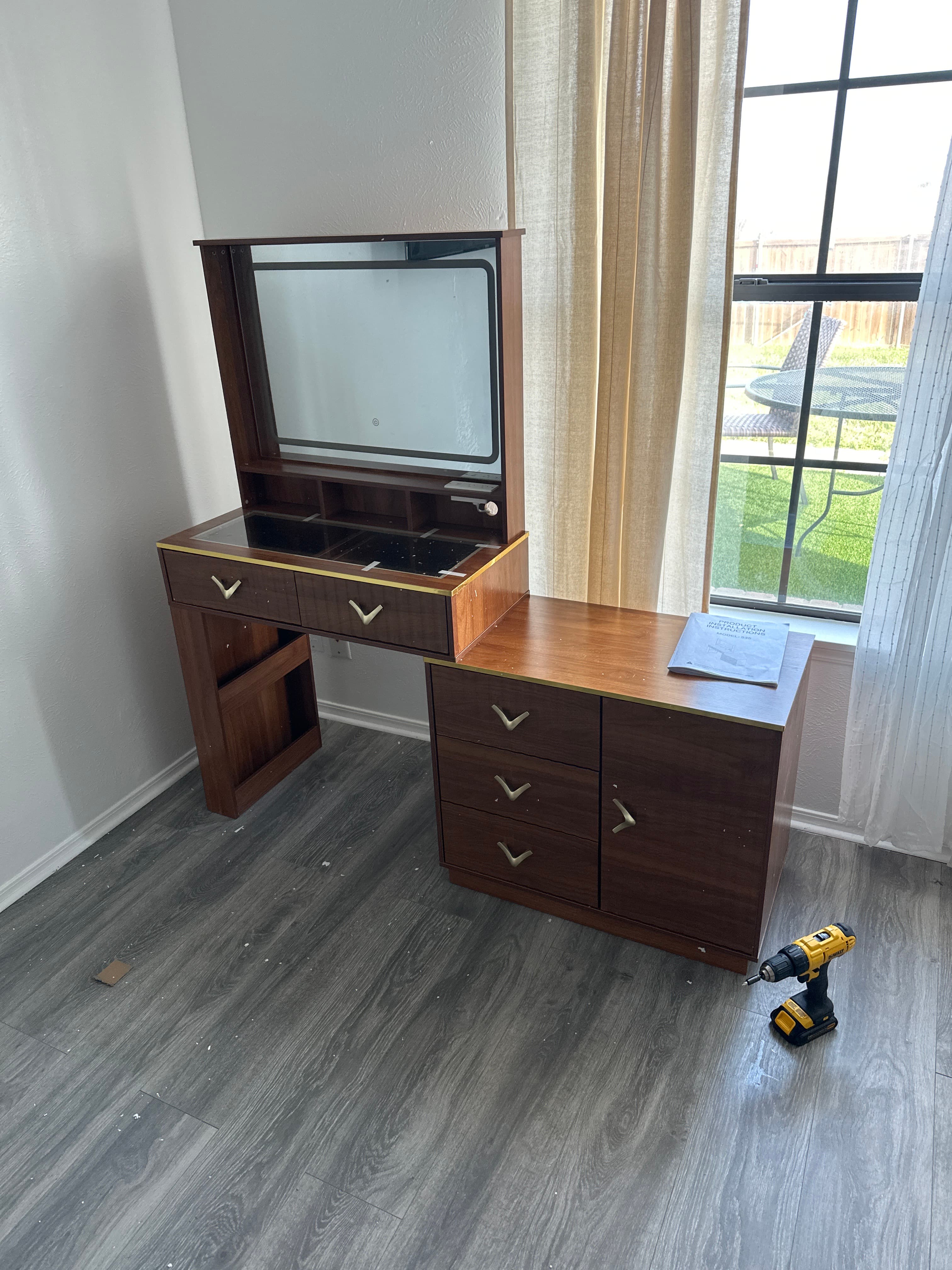 Tall wooden wardrobe with light wood finish