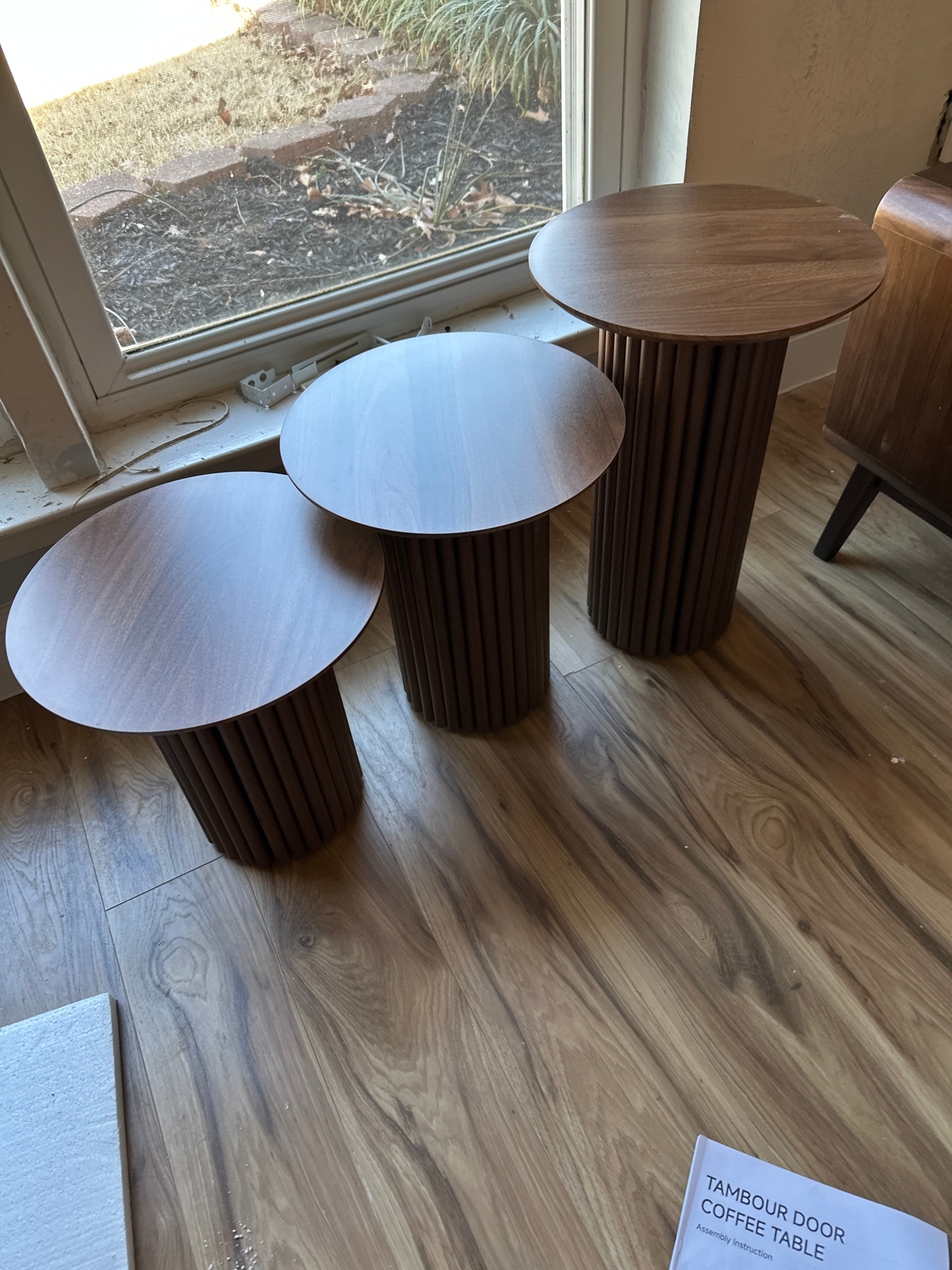 Set of three round wooden tambour coffee tables