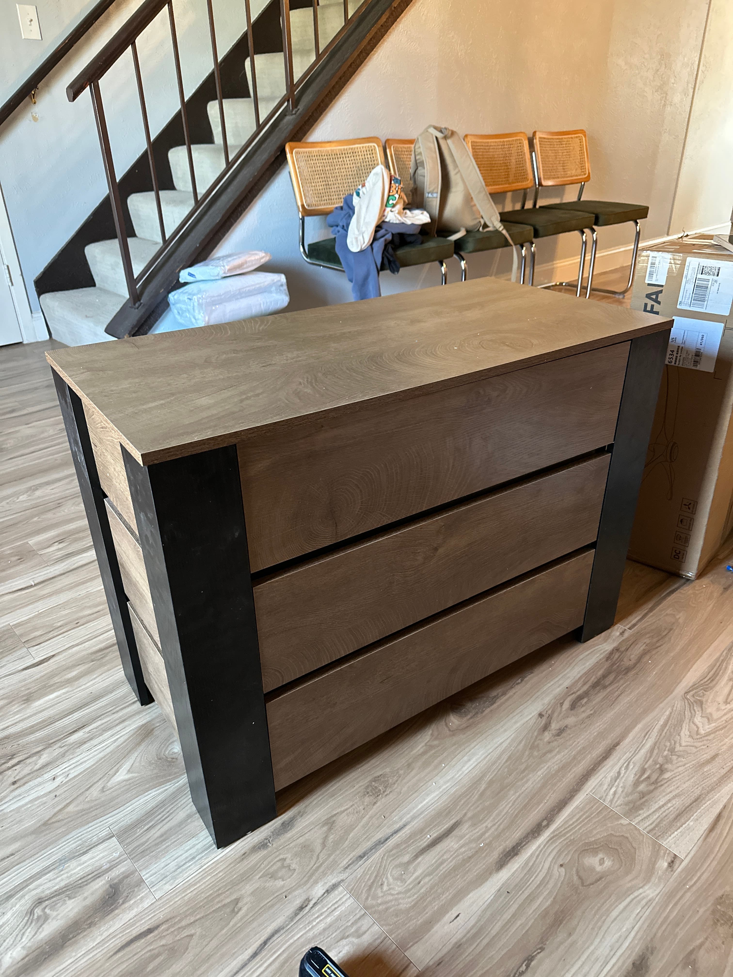 Dark brown TV stand with slatted front design