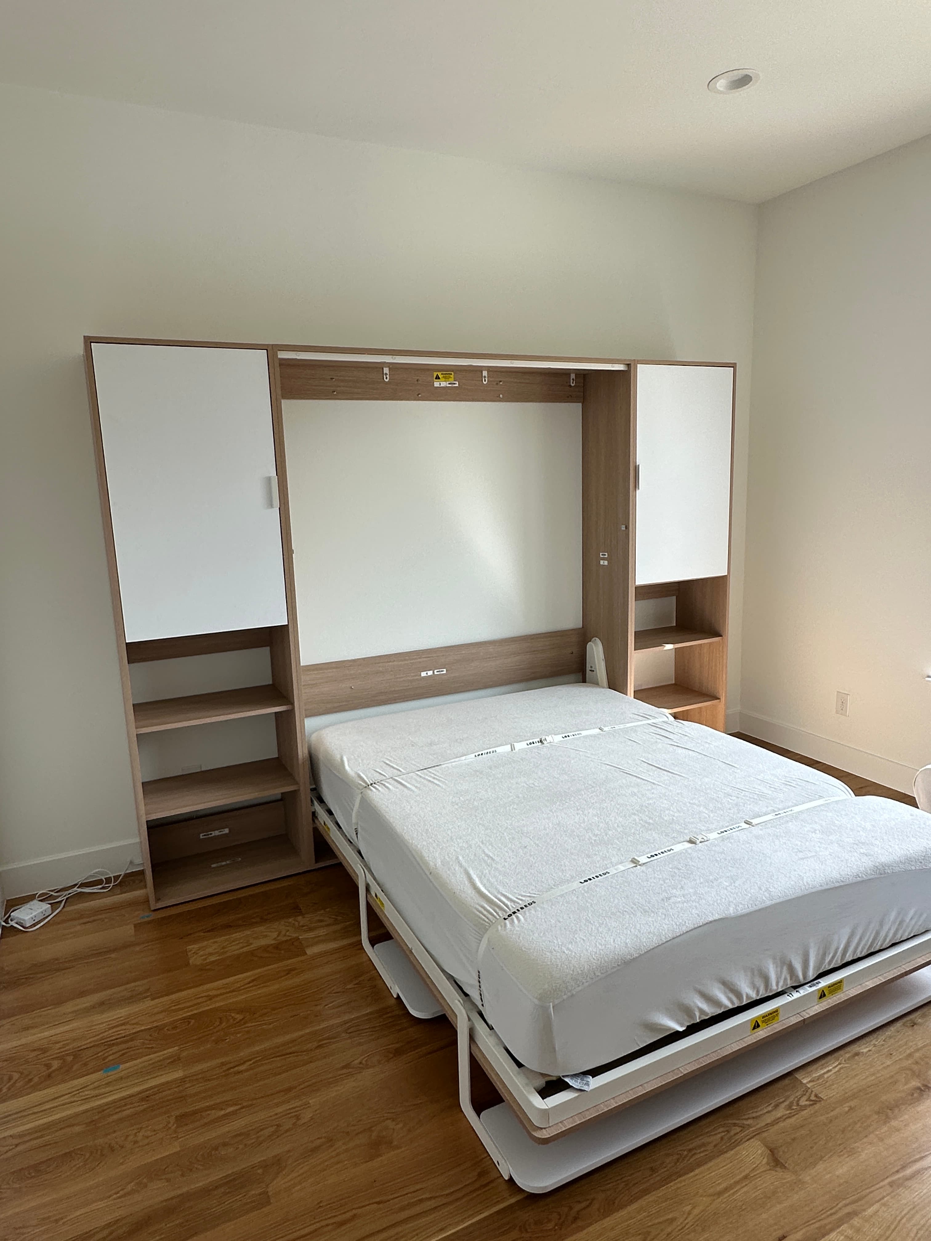 Light wood bed base with storage drawers