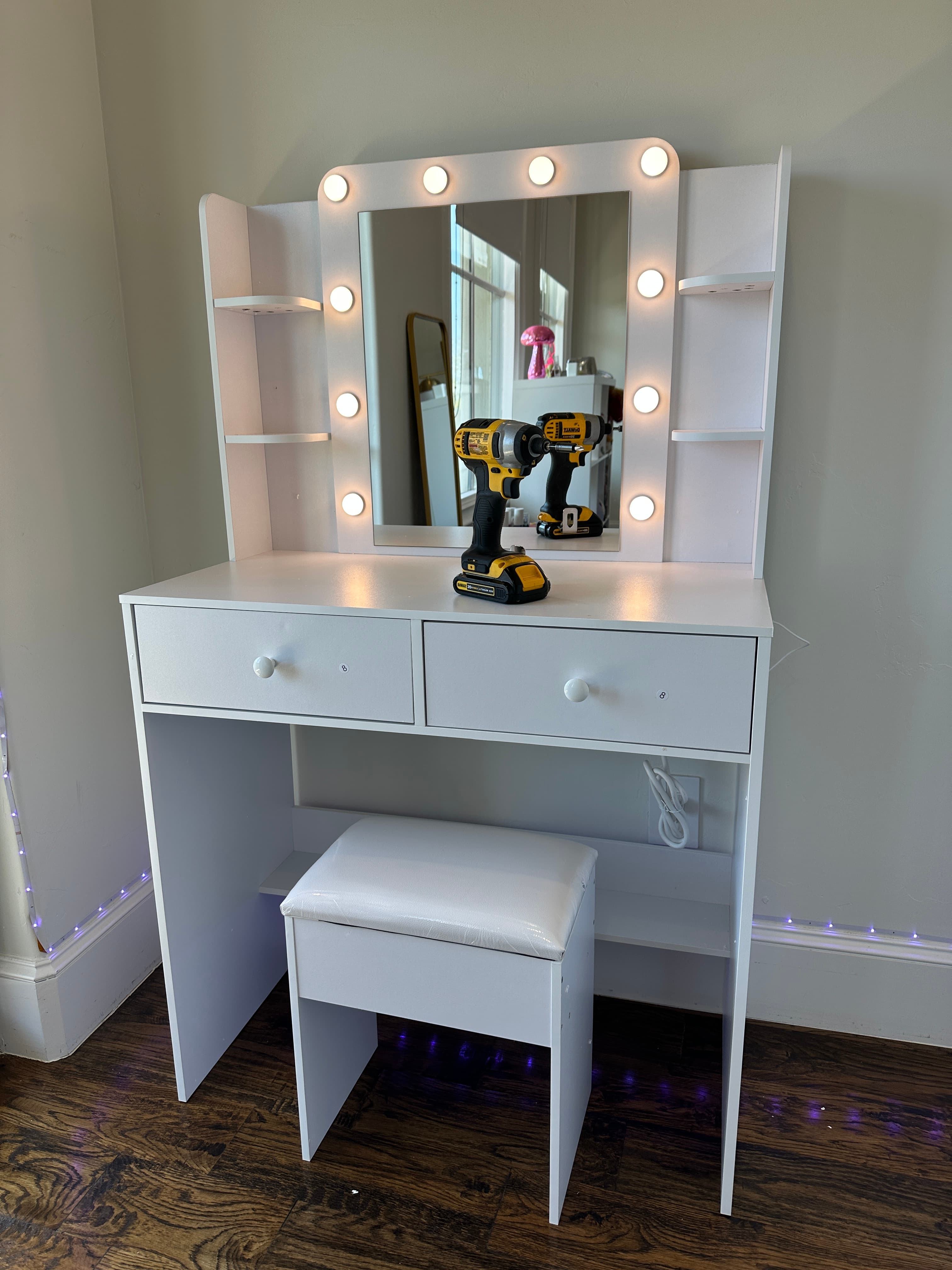 White vanity mirror with bulb lighting